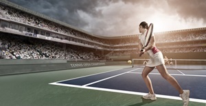 Tennis player female on blue hard court