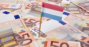 Flag of Luxembourg sticking in 50 Euro banknotes seo